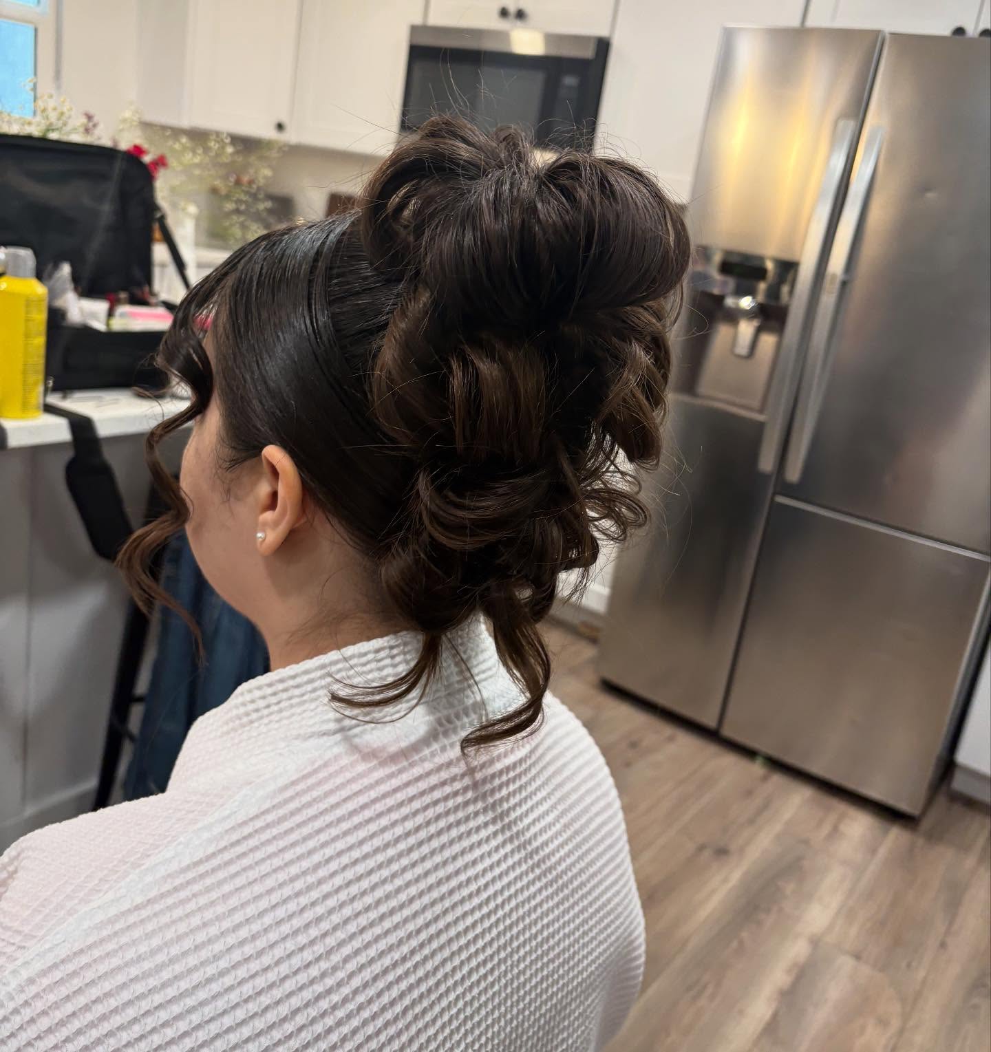 Voluminous textured updo with face-framing curls by MakeupByGen